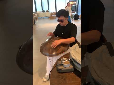 At the Asian Handpan Art Festival, Deng Jun is testing the Muling HMP‑2 pickup