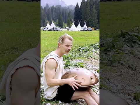 Playing Handpan by the Tipis in the Rain